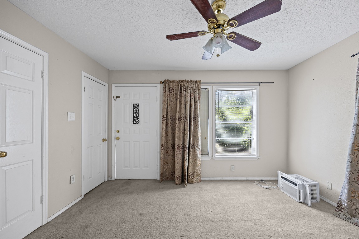 908 Vargas Road Austin, TX 78741 - Photo 10 of 28 a view of an empty room with a window