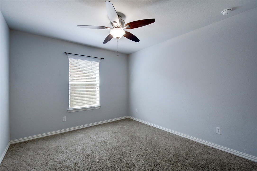 3621 Rams Horn Way Round Rock, TX 78665 - Photo 18 of 24 an empty room with a window and a fan