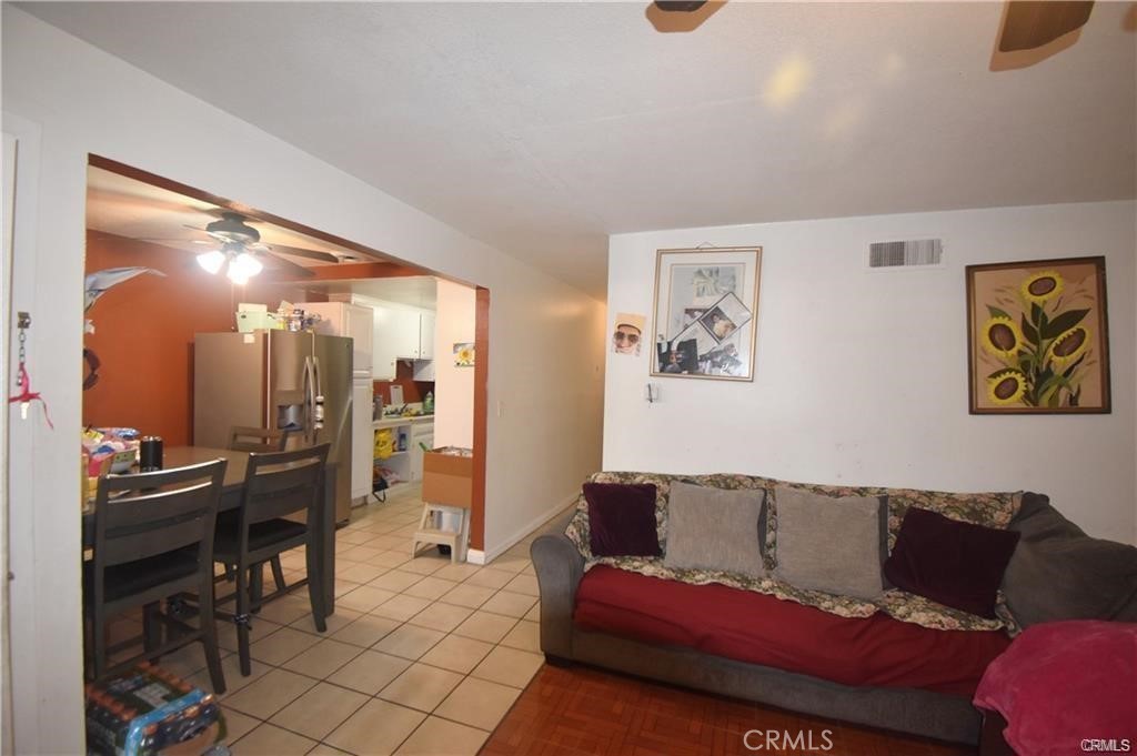 9155 Pacific Avenue, Unit 265 Anaheim, CA 92804 - Photo 16 of 18 a living room with furniture and a flat screen tv