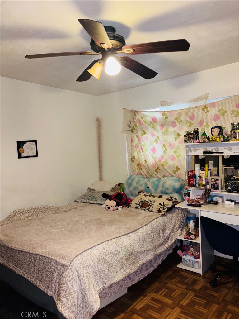 9155 Pacific Avenue, Unit 265 Anaheim, CA 92804 - Photo 8 of 18 a bedroom with a bed and a flat screen tv