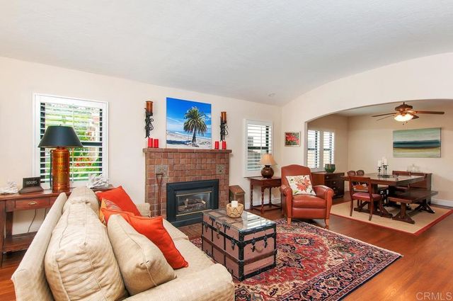 a living room with furniture rug and window