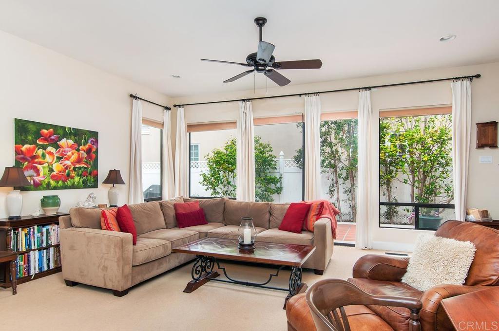 1033 Encino Row Coronado, CA 92118 - Photo 4 of 11 a living room with furniture a rug and a large window