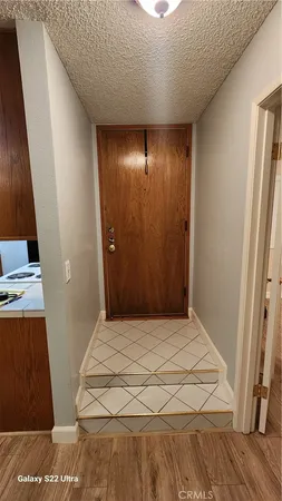 a bedroom with a bed and a mirror