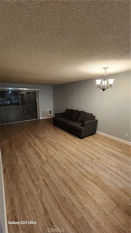 a view of a room with a wooden floor