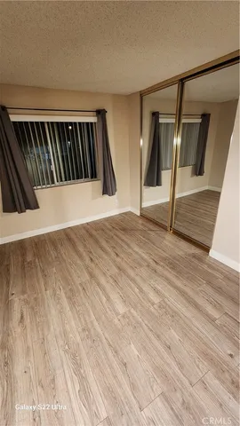 a view of staircase with wooden floor and stairs