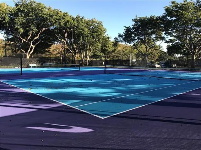 a view of a swimming pool with an outdoor seating