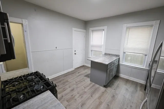 a living room with a couch and a window