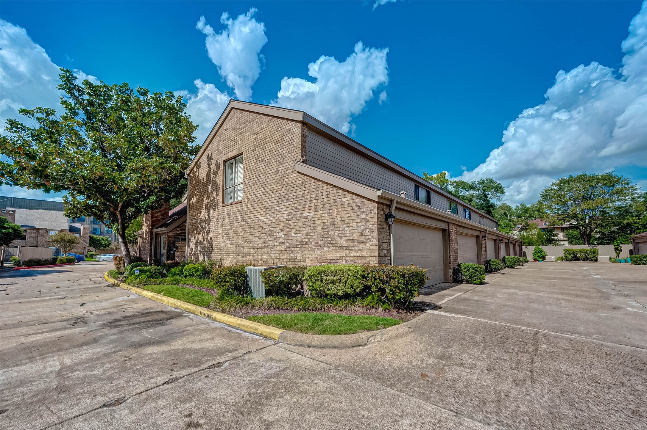 1908 Augusta Drive, Unit 7 Houston, TX 77057 - Photo 31 of 33 a front view of a house with a yard