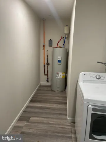 a view of a storage & utility room with a washer dryer