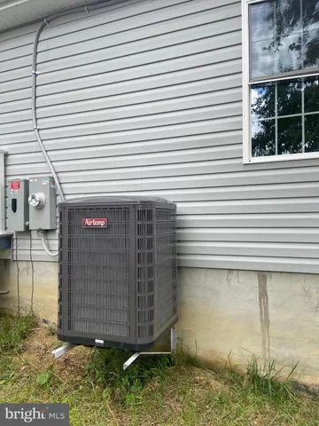 a view of a small house with roof