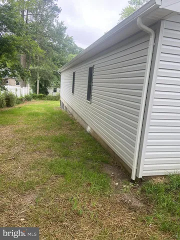 a view of a backyard with large trees