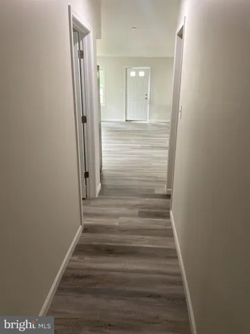 a view of entryway with wooden floor