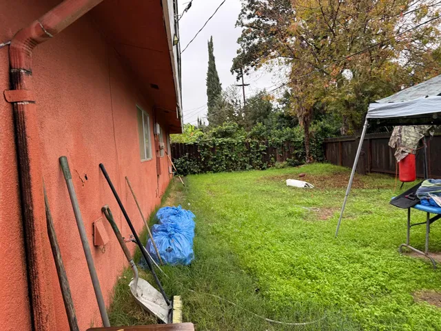 a view of a backyard with swings
