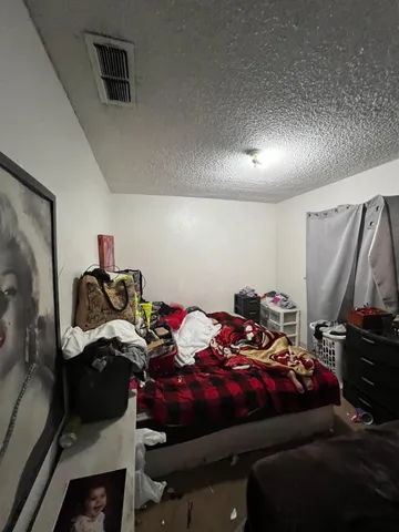 a bedroom with a bed and a closet