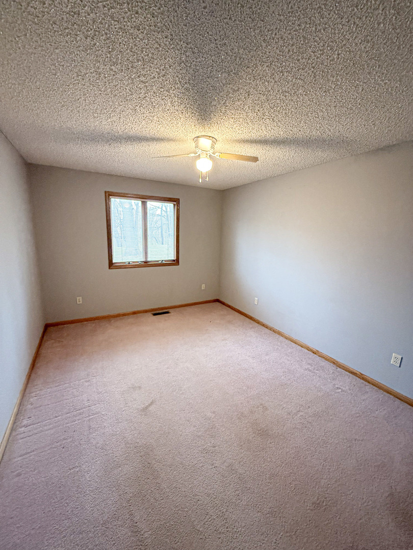 1599 East 2700 North Road Clifton, IL 60927 - Photo 19 of 26 a view of an empty room with a window