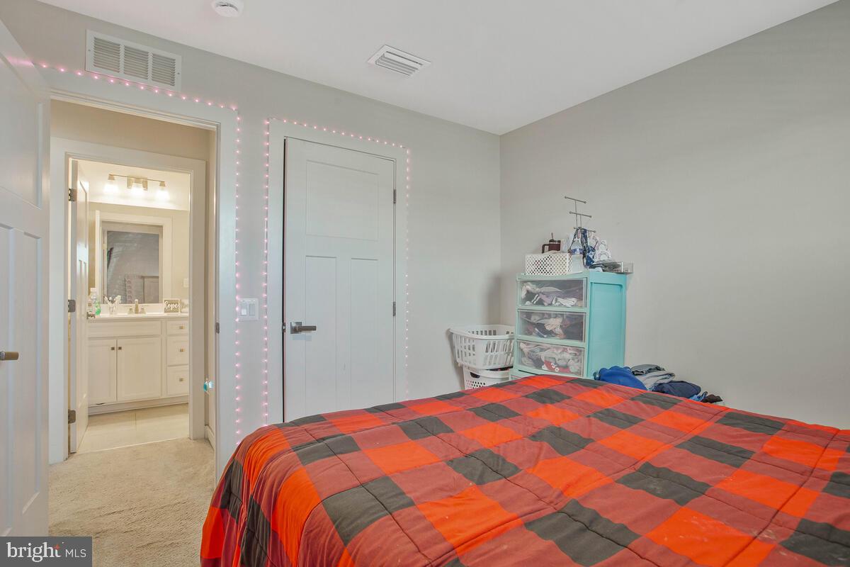 14304 Longhouse Loop, Unit A Brandywine, MD 20613 - Photo 25 of 72 a bedroom with a bed and closet