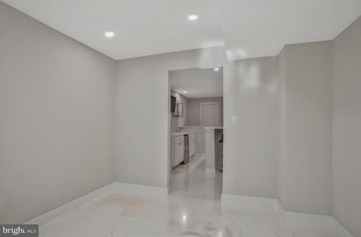 14304 Longhouse Loop, Unit A Brandywine, MD 20613 - Photo 30 of 72 a bathroom with a shower and a sink