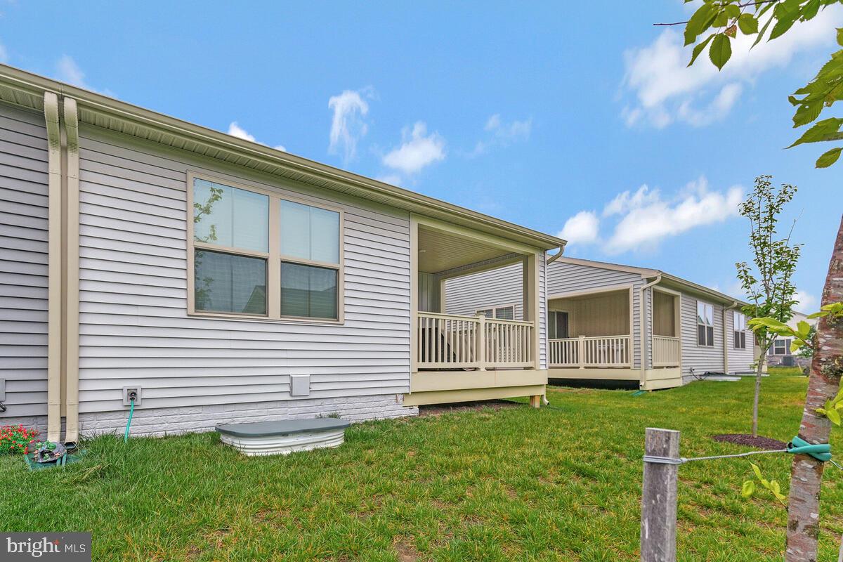 14304 Longhouse Loop, Unit A Brandywine, MD 20613 - Photo 48 of 72 a view of a house with a yard