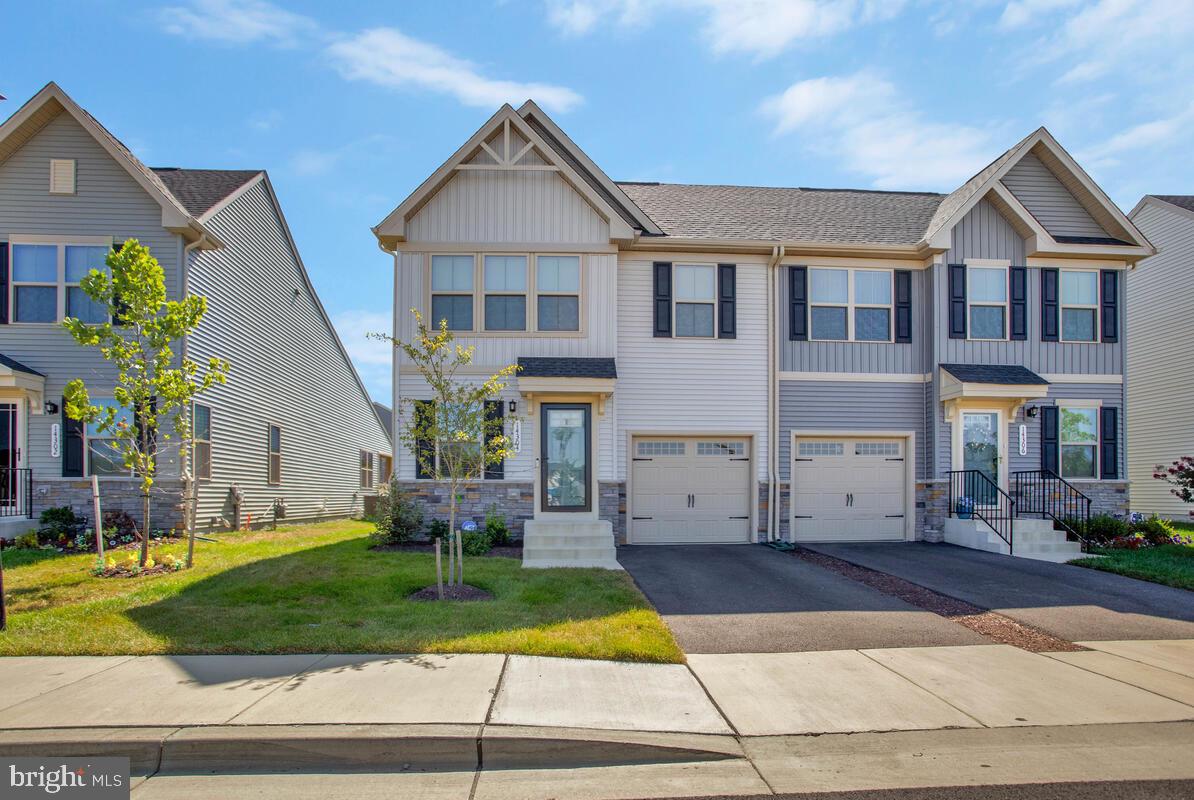 14304 Longhouse Loop, Unit A Brandywine, MD 20613 - Photo 5 of 72 a front view of house with yard and green space