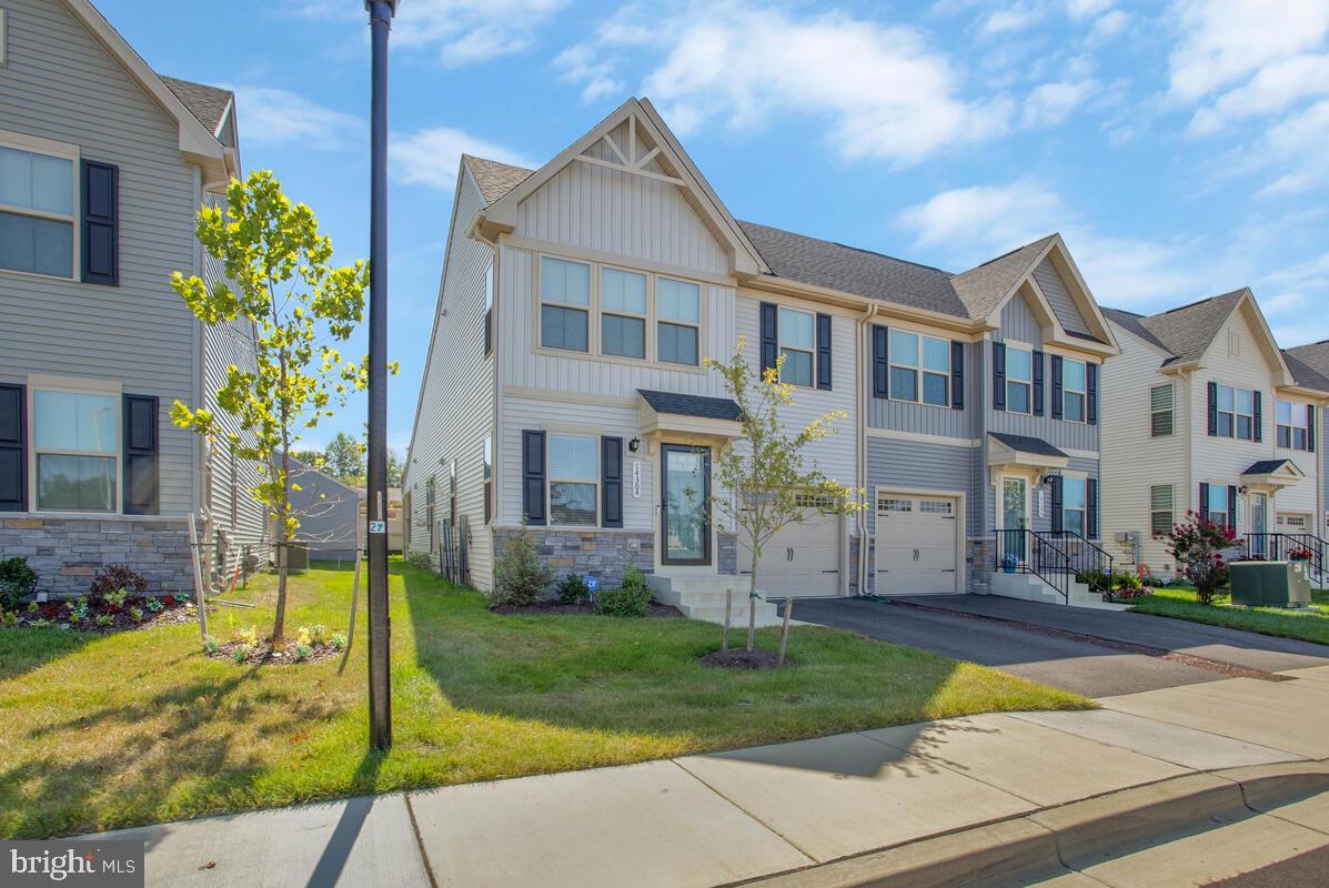 14304 Longhouse Loop, Unit A Brandywine, MD 20613 - Photo 6 of 72 a front view of house with yard and green space