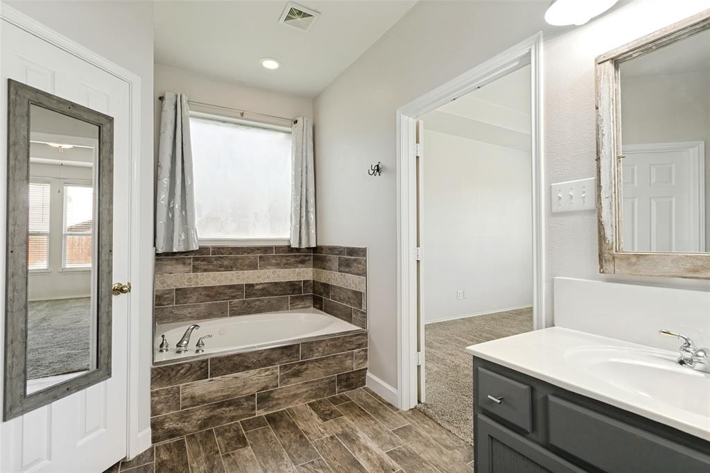 4107 Waverly Road Corinth, TX 76208 - Photo 16 of 30 The 2020 updates also included the custom tile surround for the jetted tub.