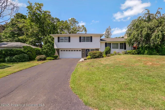 a view of a house with a garden