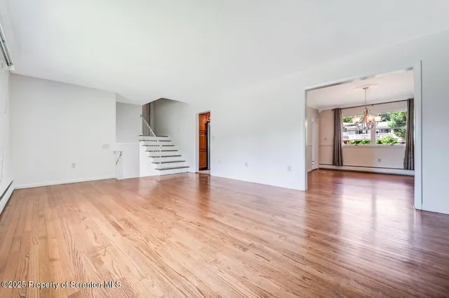a kitchen with stainless steel appliances granite countertop a sink stove and wooden cabinets