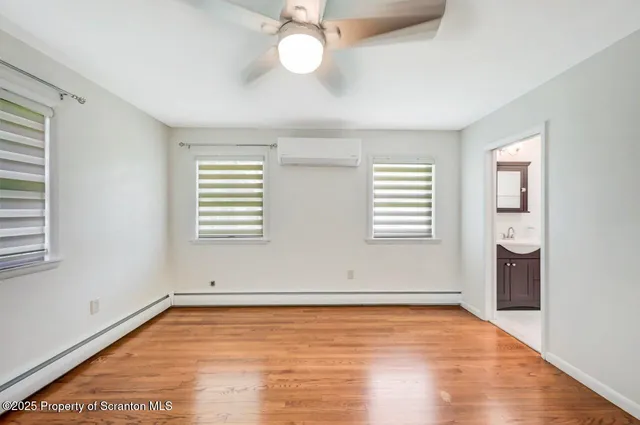 a bathroom with a sink toilet and mirror