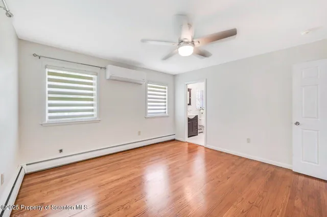 a bathroom with a toilet a sink and shower