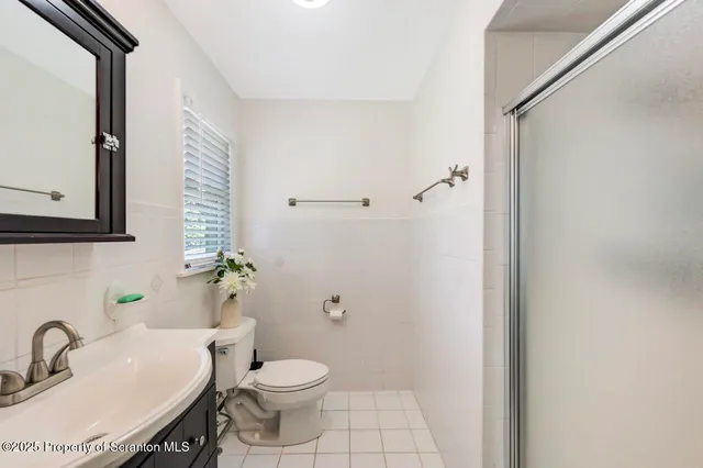 a en suite bathroom with a sink and mirror