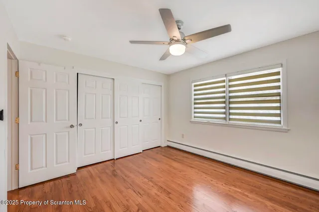 a bathroom with a sink mirror and toilet