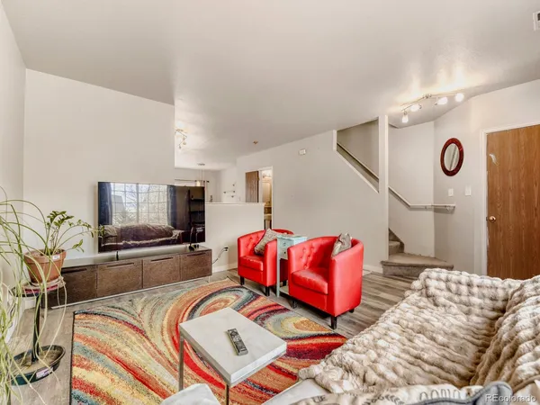 a bedroom with a bed and couch