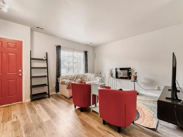 a view of a livingroom with furniture and a flat screen tv