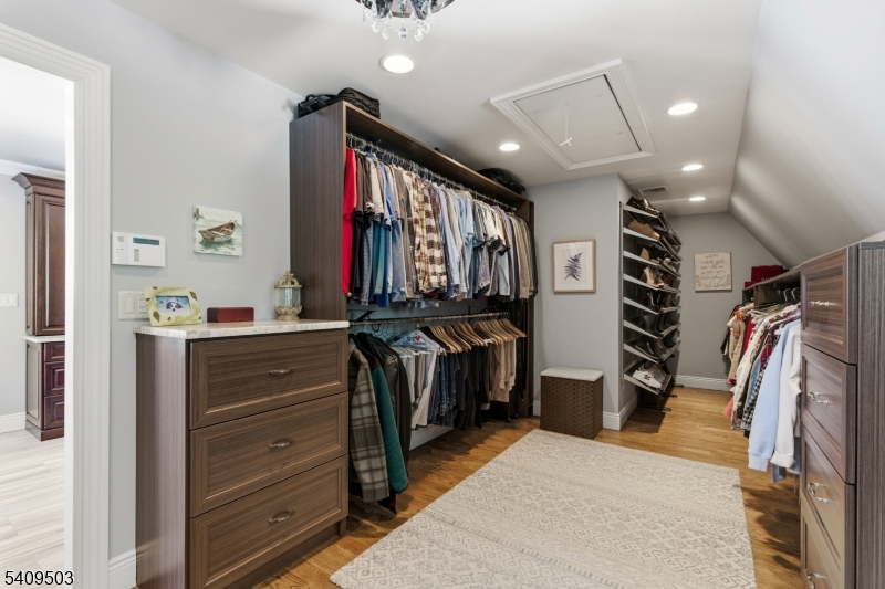 89 Woods Road Branchville, NJ 07826 - Photo 22 of 49 a view of walk in closet with clothes and shoes