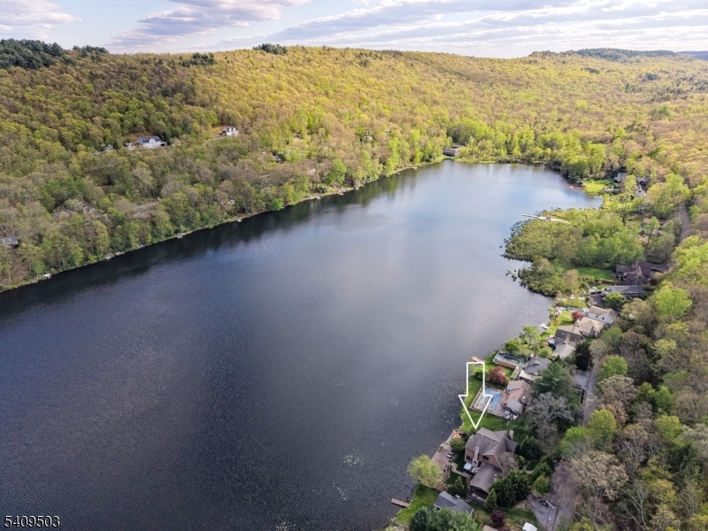 89 Woods Road Branchville, NJ 07826 - Photo 48 of 49 a view of a lake with a mountain in the background