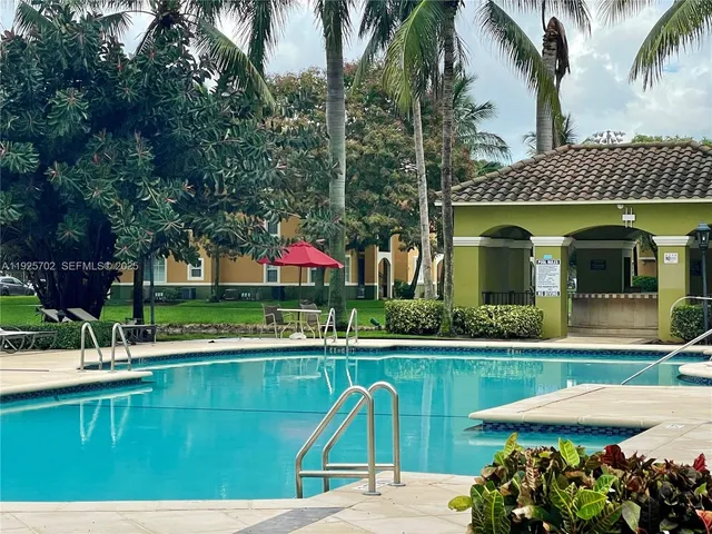 a view of a swimming pool with a patio