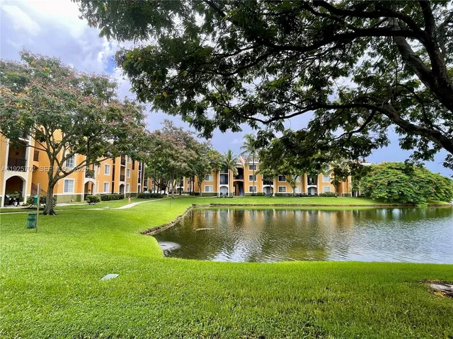 a view of a lake with a building in the background