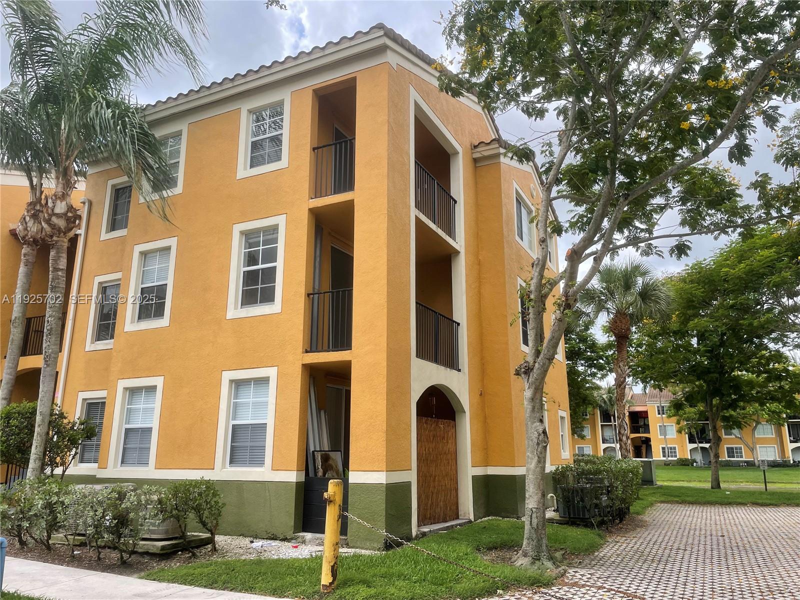 2080 West Preserve Way, Unit 207 Miramar, FL 33025 - Photo 18 of 20 a front view of a house with a yard