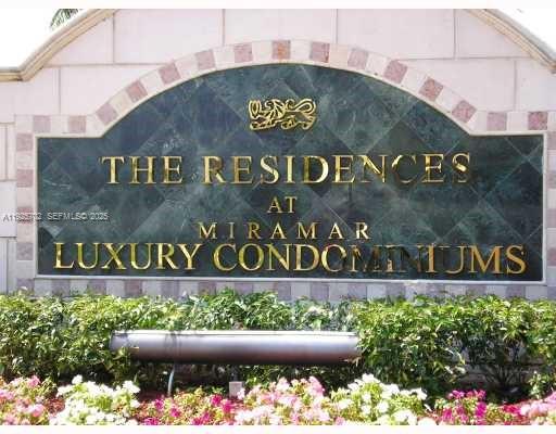 2080 West Preserve Way, Unit 207 Miramar, FL 33025 - Photo 20 of 20 a street sign that is sitting in front of flowers