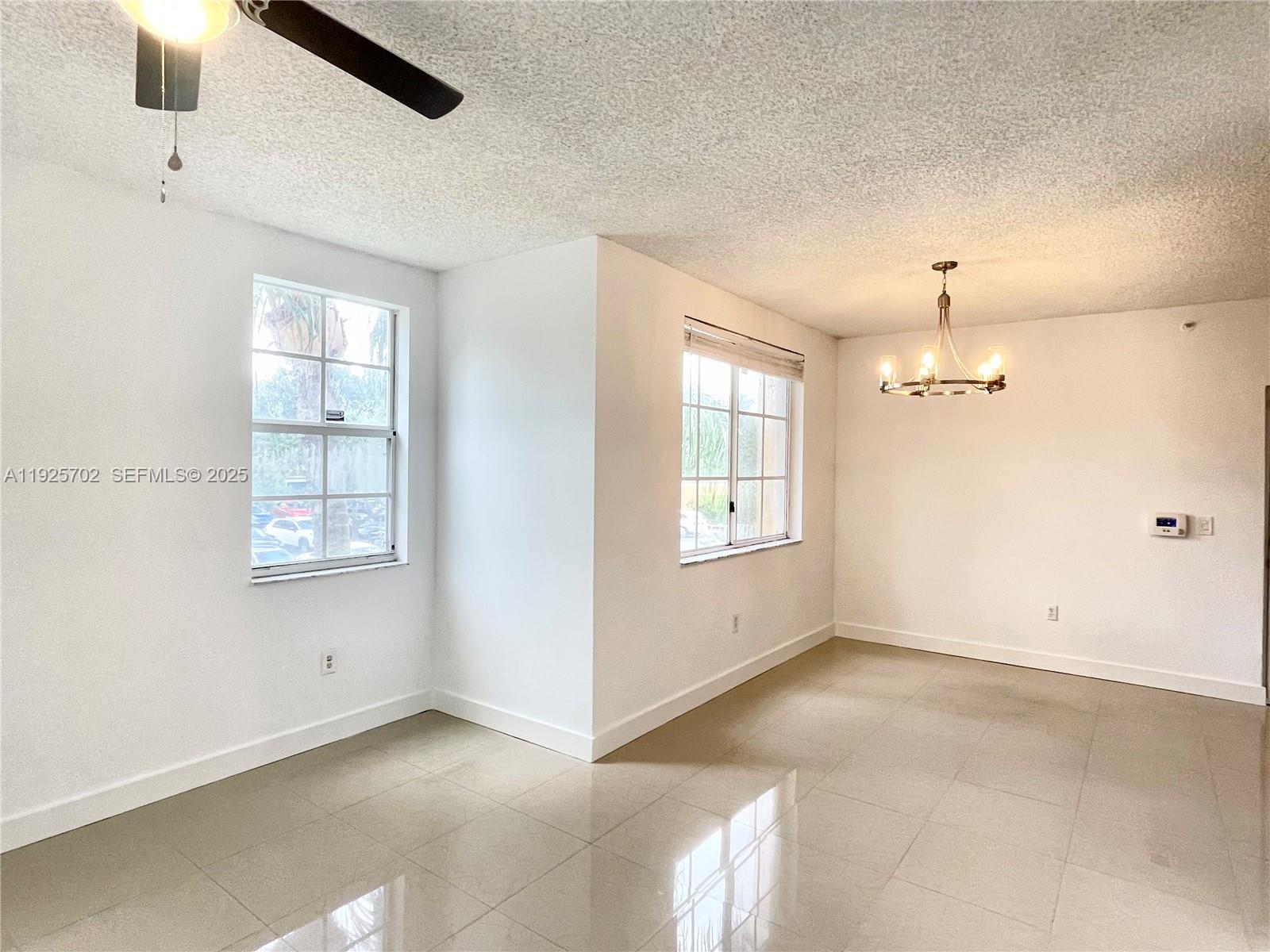 2080 West Preserve Way, Unit 207 Miramar, FL 33025 - Photo 2 of 20 a view of an empty room with a window