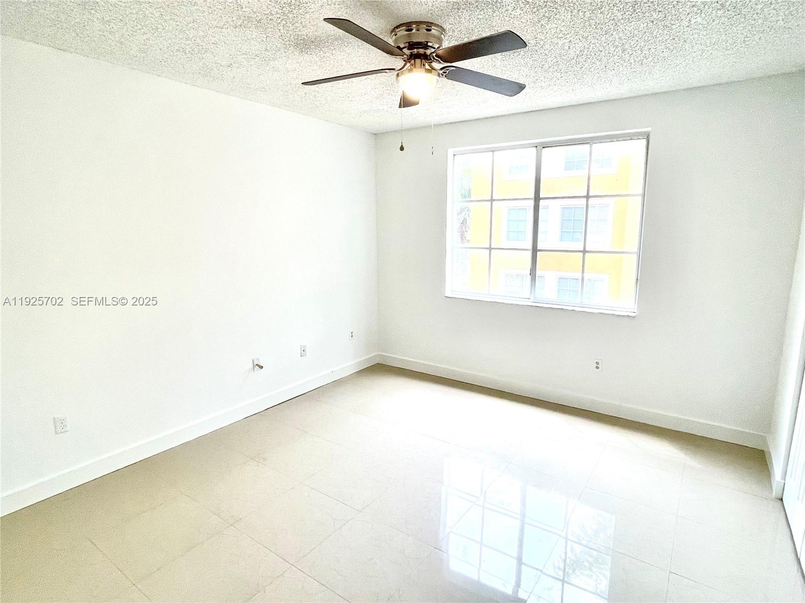 2080 West Preserve Way, Unit 207 Miramar, FL 33025 - Photo 3 of 20 a view of an empty room with a window