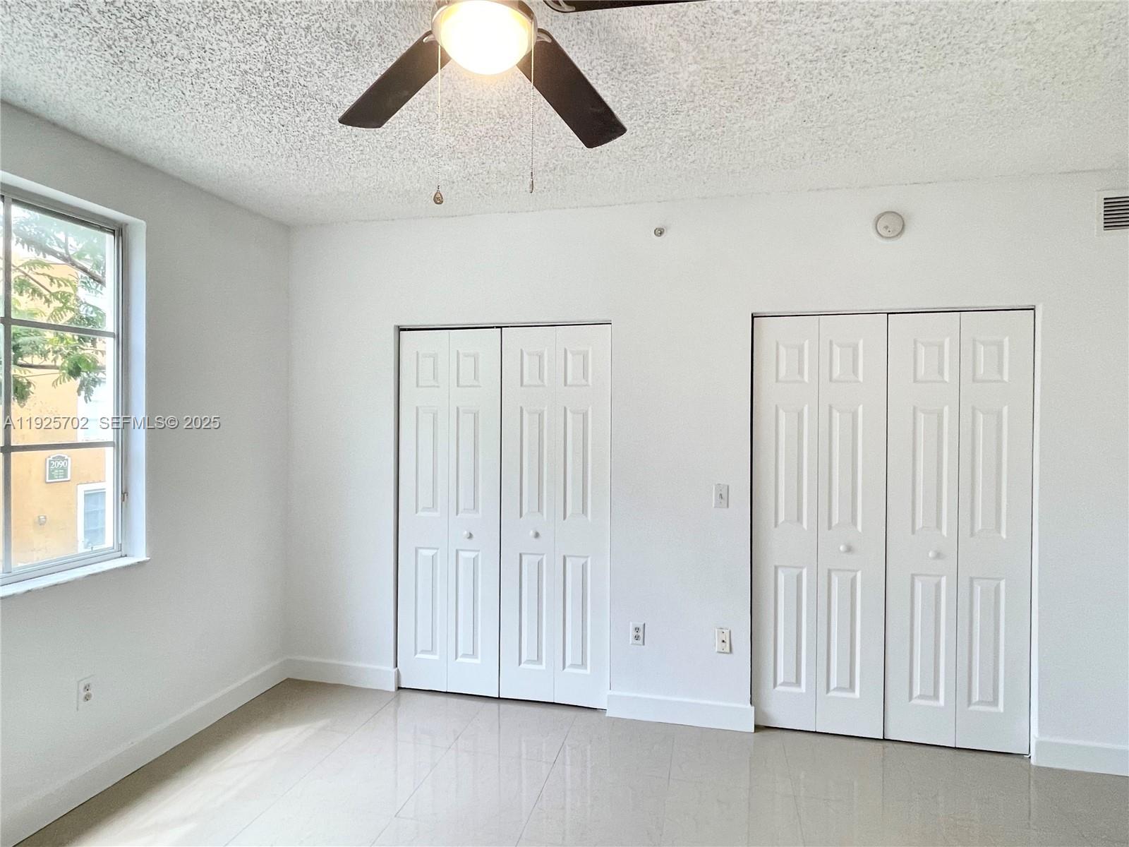 2080 West Preserve Way, Unit 207 Miramar, FL 33025 - Photo 5 of 20 an empty room with windows