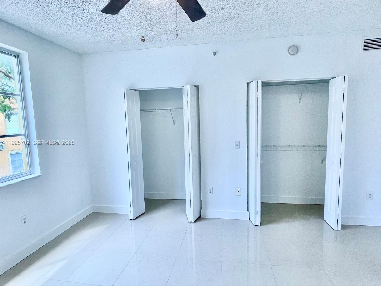 2080 West Preserve Way, Unit 207 Miramar, FL 33025 - Photo 6 of 20 a view of an empty room with a window