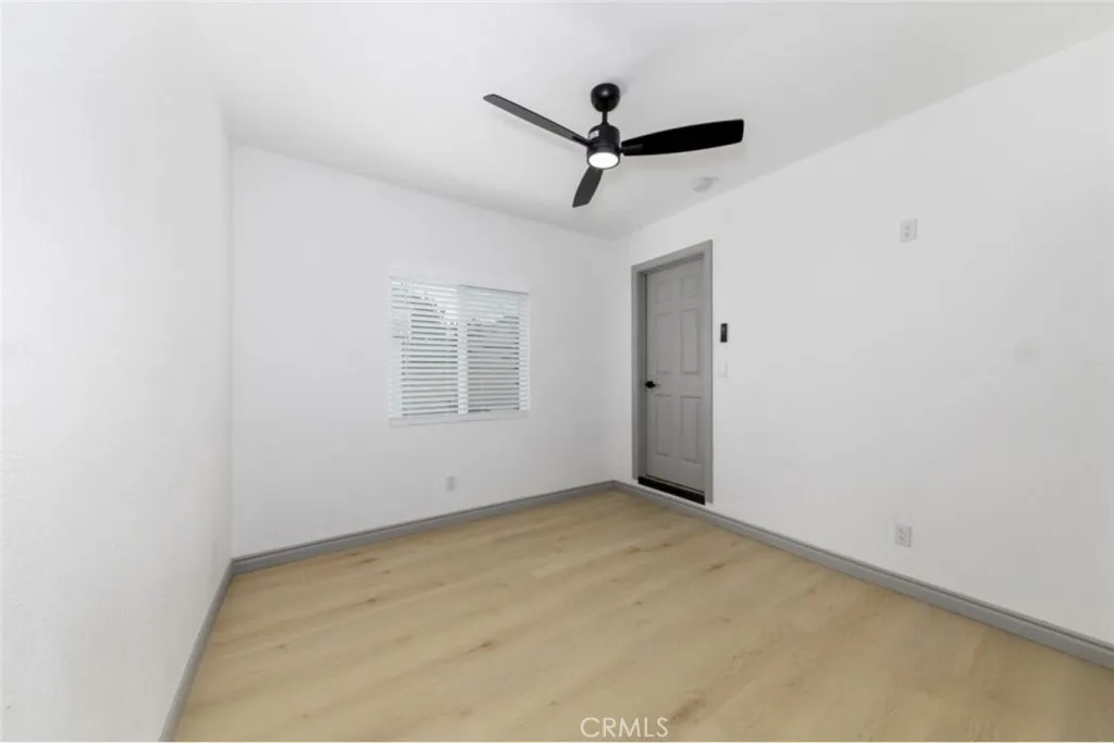 10 West Trafford Street Long Beach, CA 90805 - Photo 3 of 6 a view of a big room with carpet and a ceiling fan