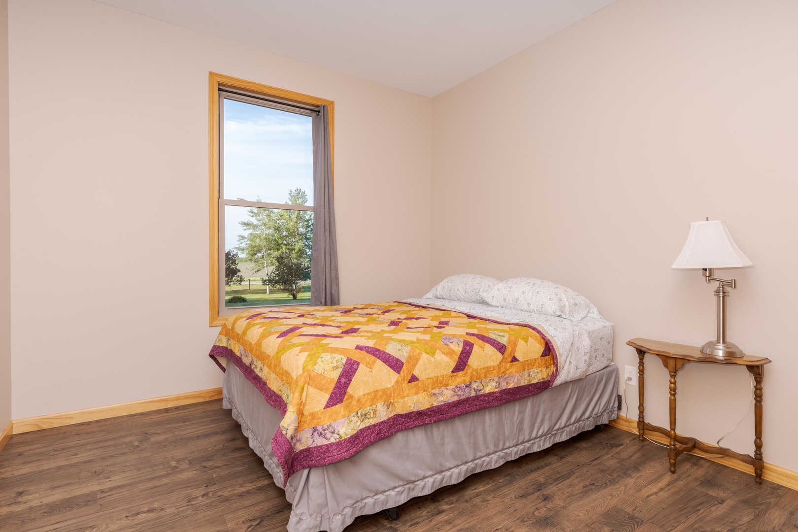 22037 East 2600 N Road Odell, IL 60460 - Photo 23 of 59 a bed sitting in a bedroom next to a window
