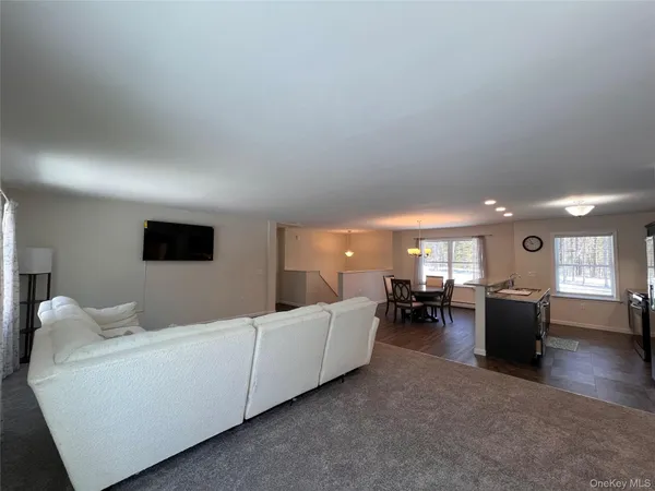 a spacious bedroom with a bed and window