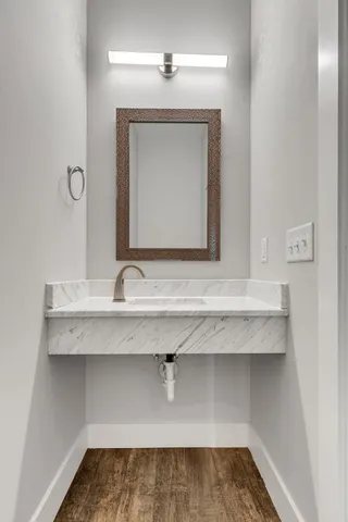 a bathroom with a sink and a mirror