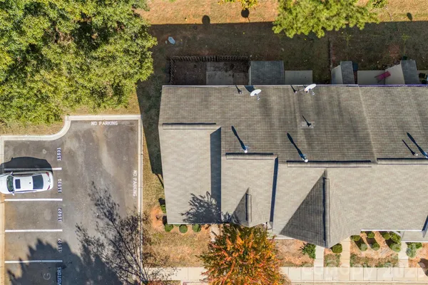 an aerial view of a house with a yard