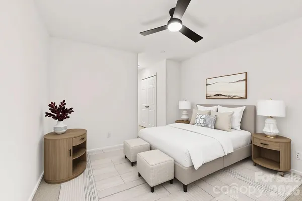 a bedroom with a bed and a chair