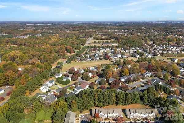 front view of a house with a tree